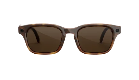 A pair of brown-tinted smart glasses with built-in cameras on the frame corners.