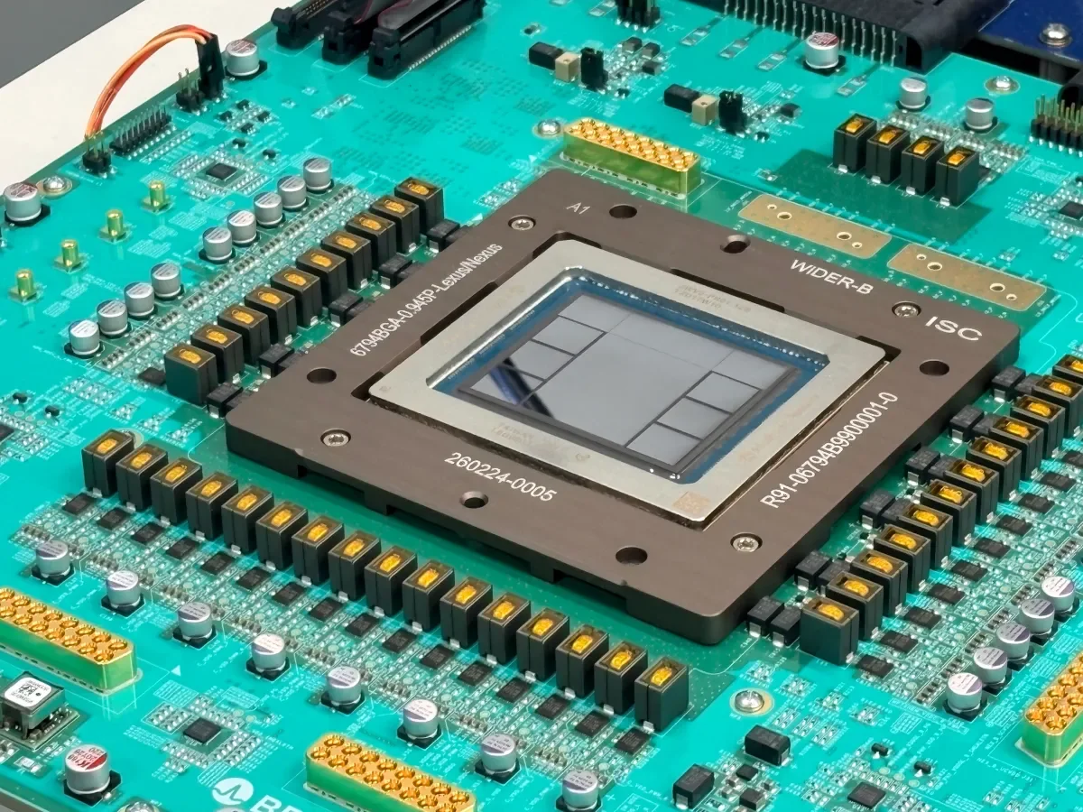 Close-up photograph of OpenAI's Jalapeño custom inference chip mounted on a green printed circuit board.